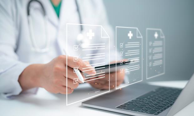 A doctor using a laptop.